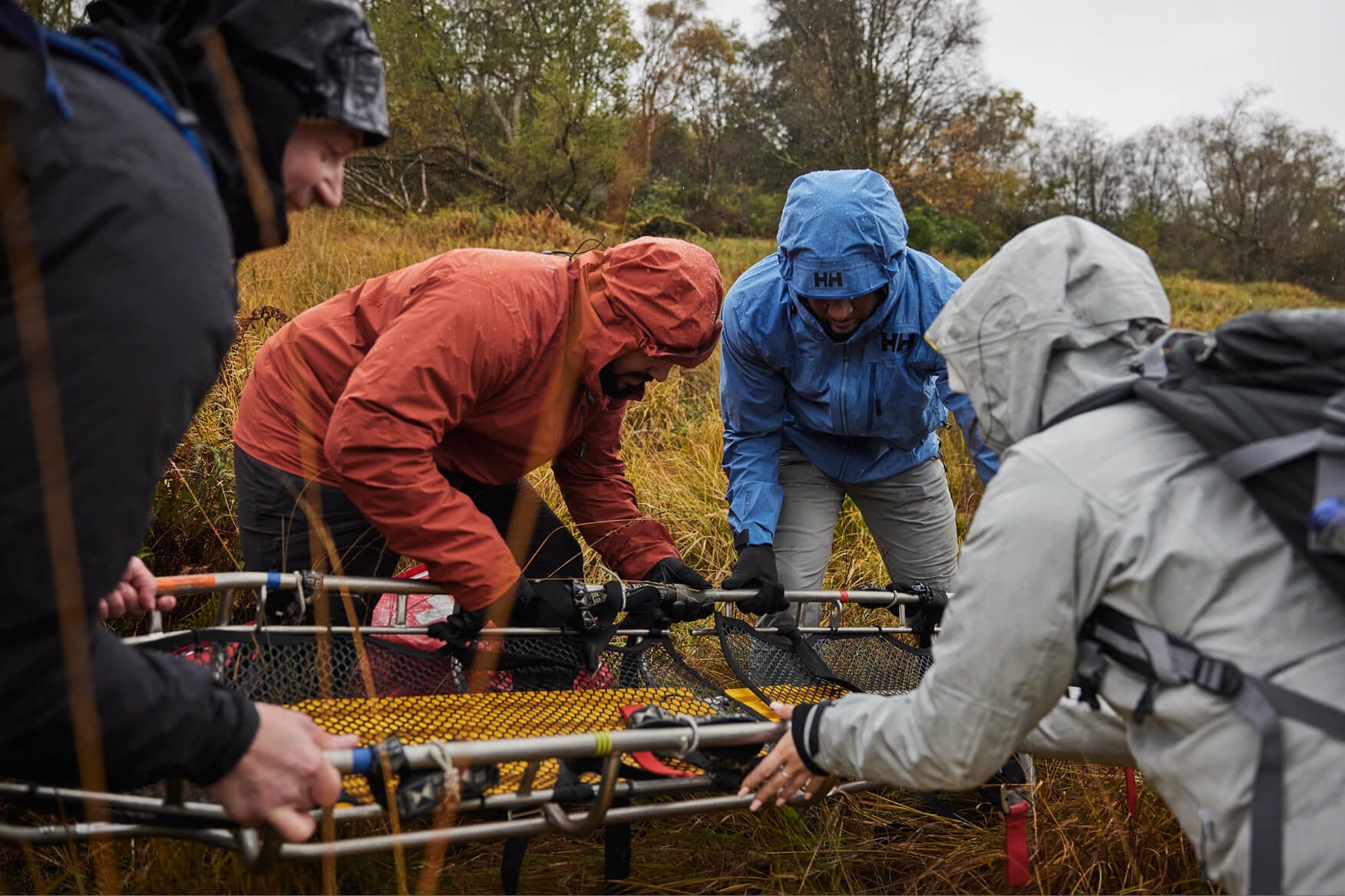 People putting together a rescue stretcher