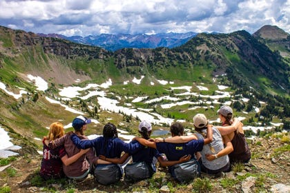 group of people in the mountains