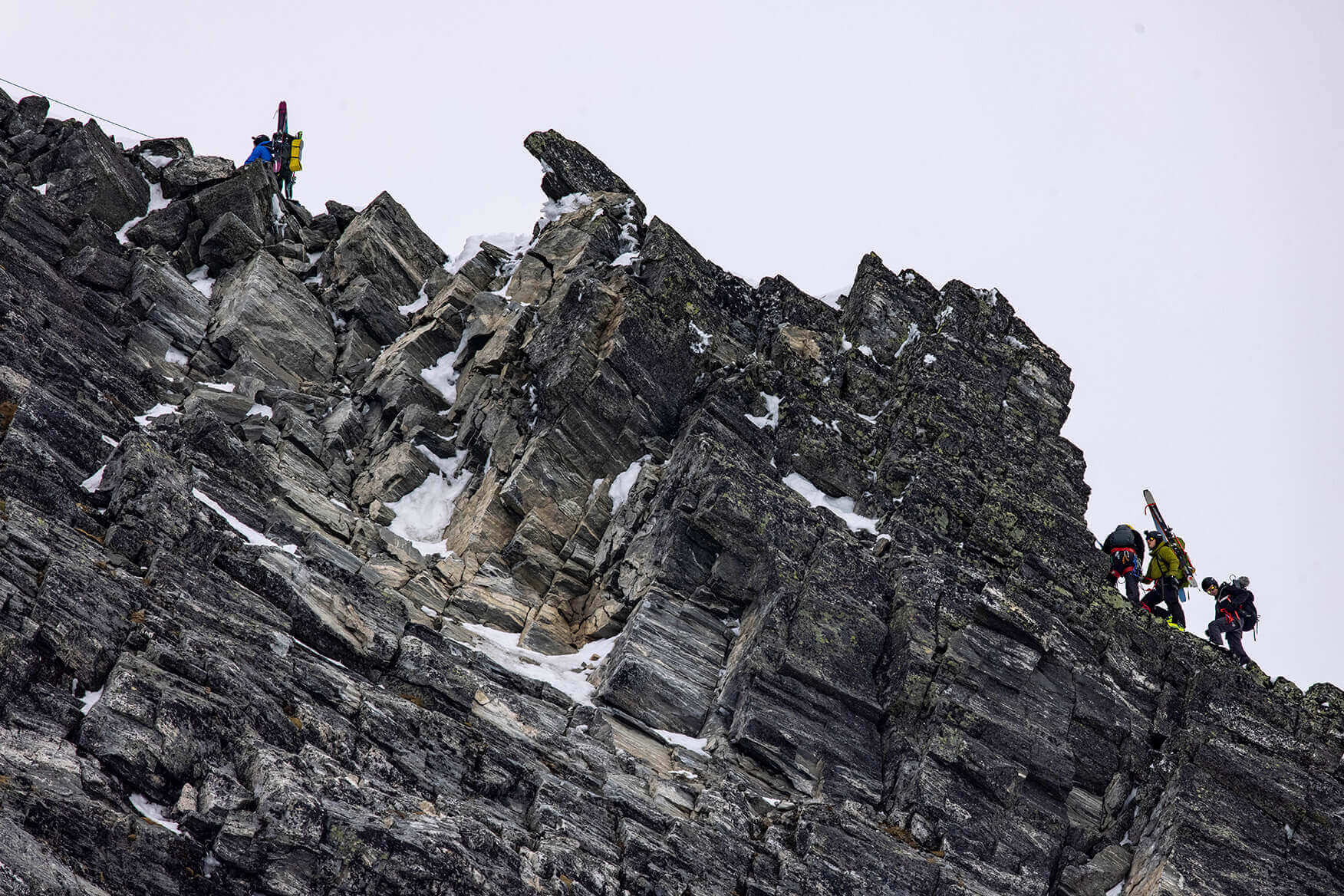 people climbing up a mountain