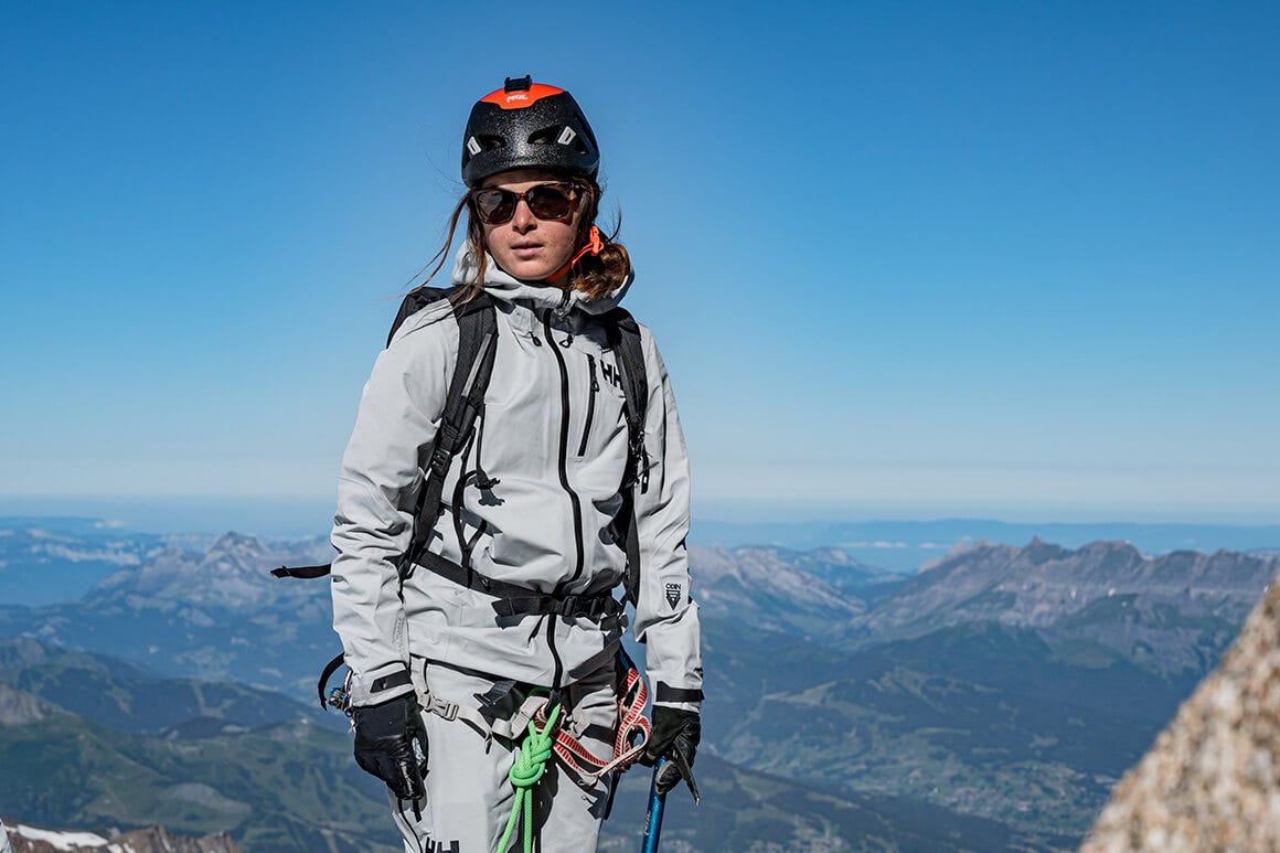 woman hiking a ridge