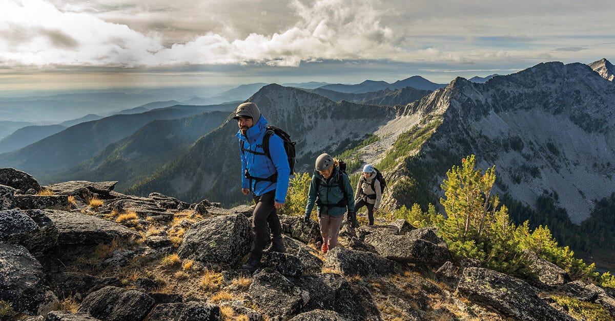 Three people hiking in the mountains