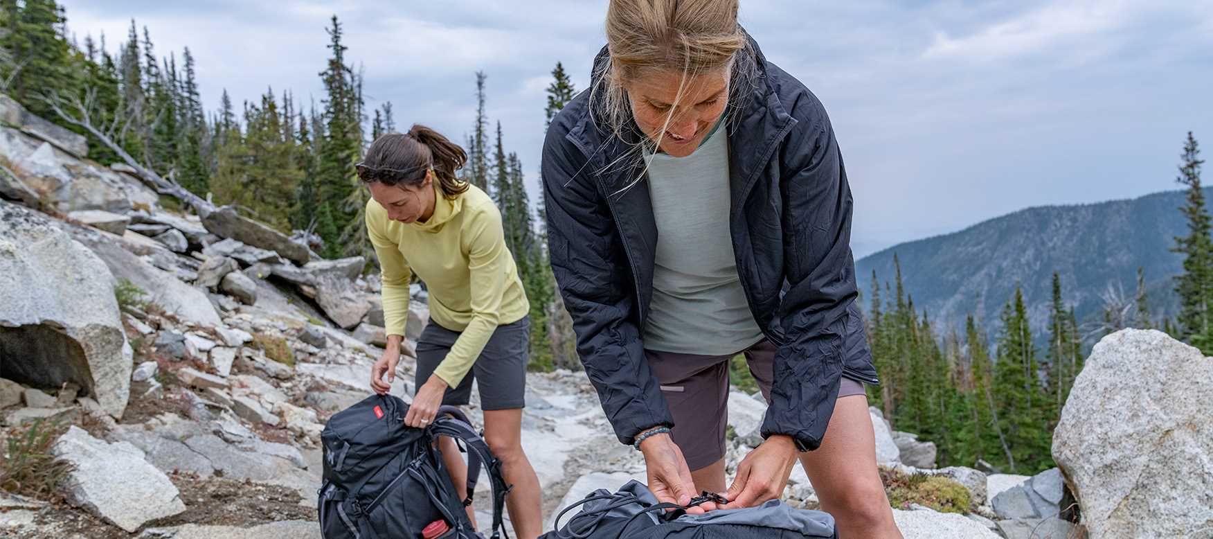 two women wearing base layers on a hike