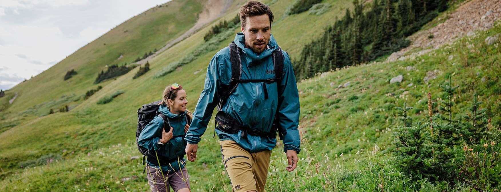 man and woman hiking in scenic nature