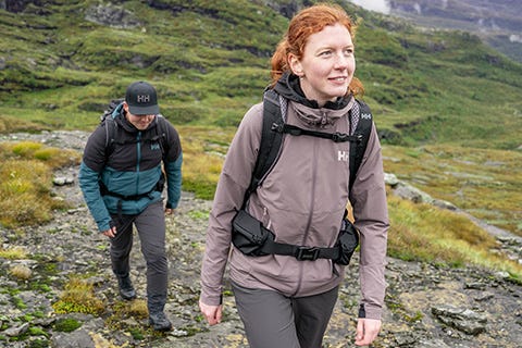 woman hiking in shell jacket and shell pants
