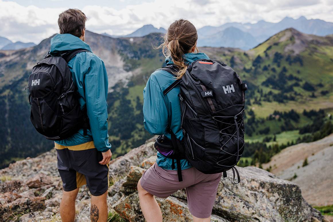 Man and woman hiking in the 45L Transistor backpacks.