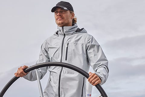 man sailing in the Crew Midlayer Jacket