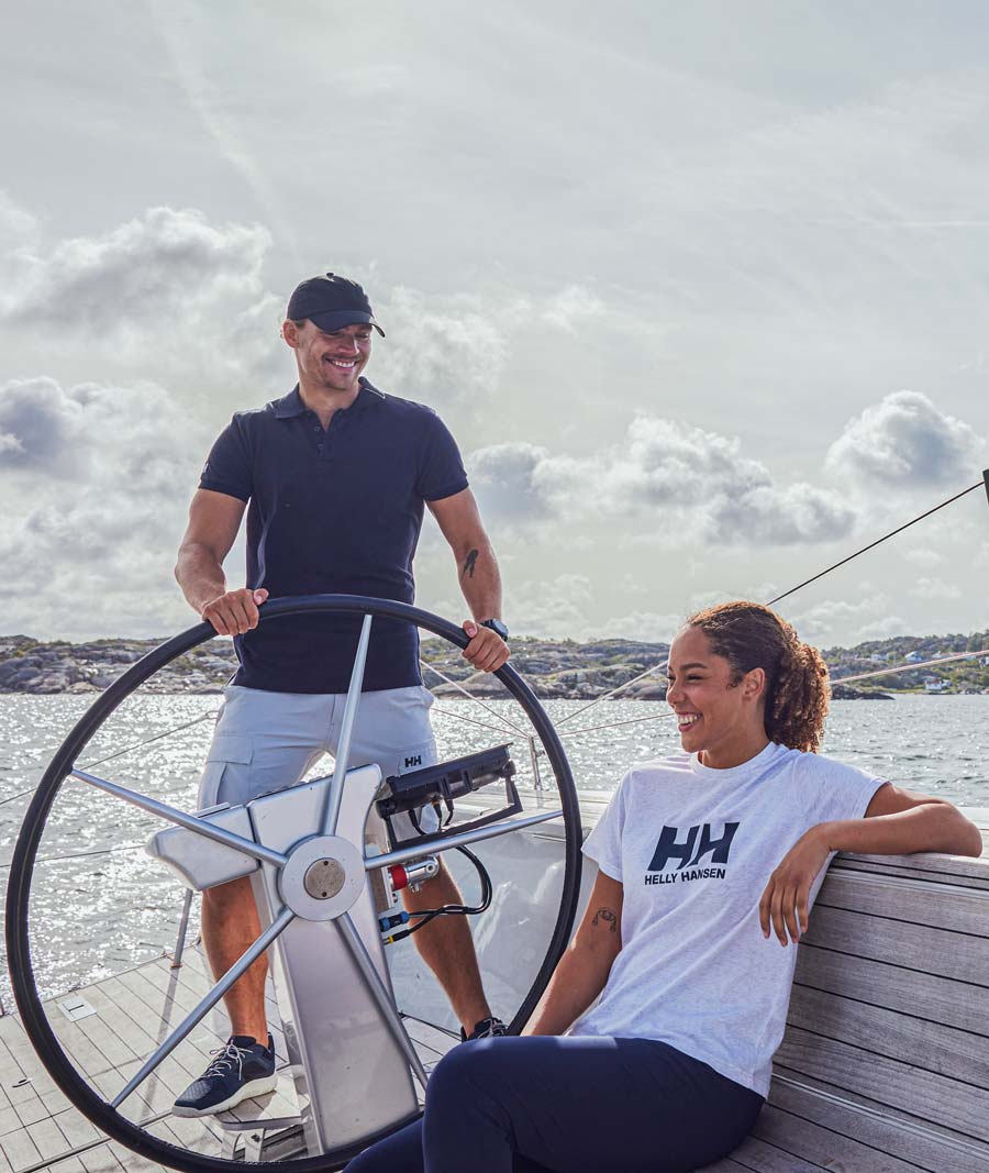Female and Male models wearing Helly Hansen Marine Lifestyle sailing clothes